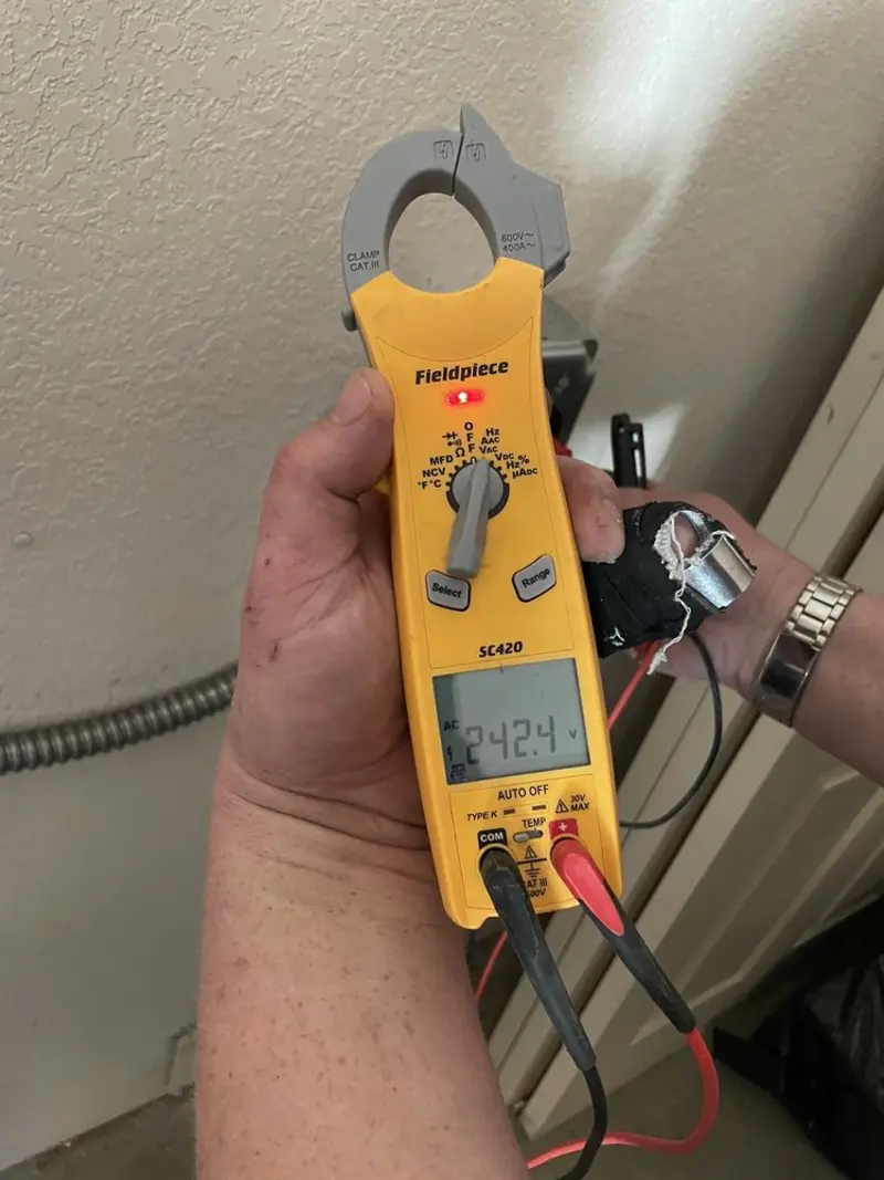 Voltage testing with clamp meter during Aluminum Wiring Replacement in North Hobbs